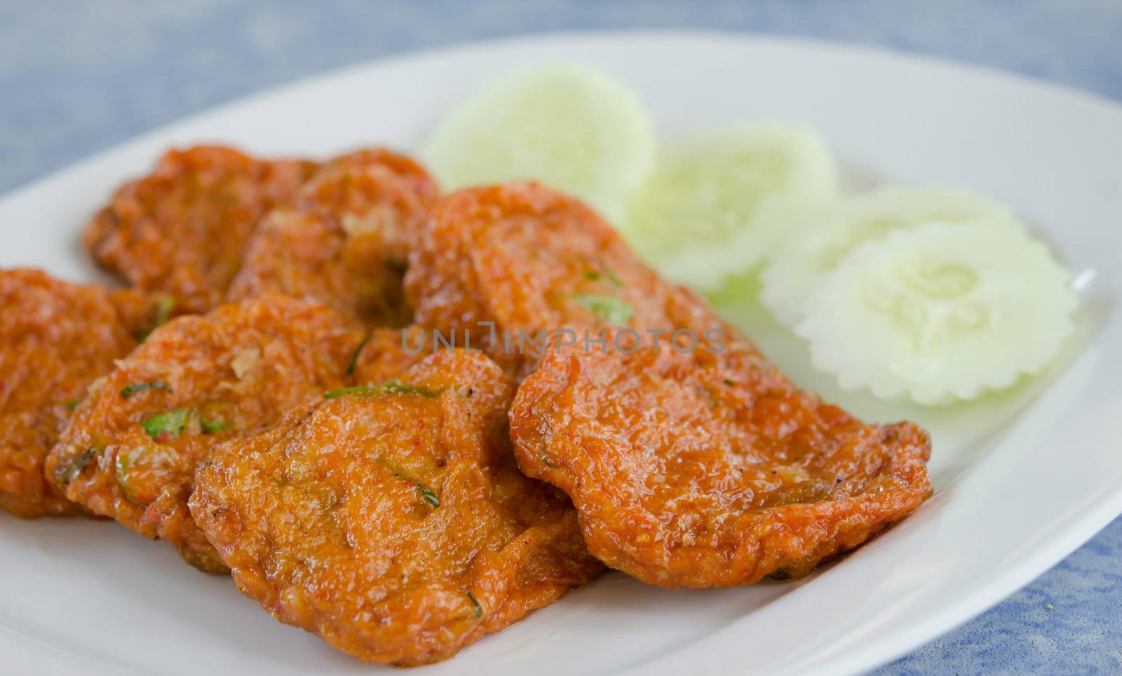 Spicy fried fish cake  served with cucumber