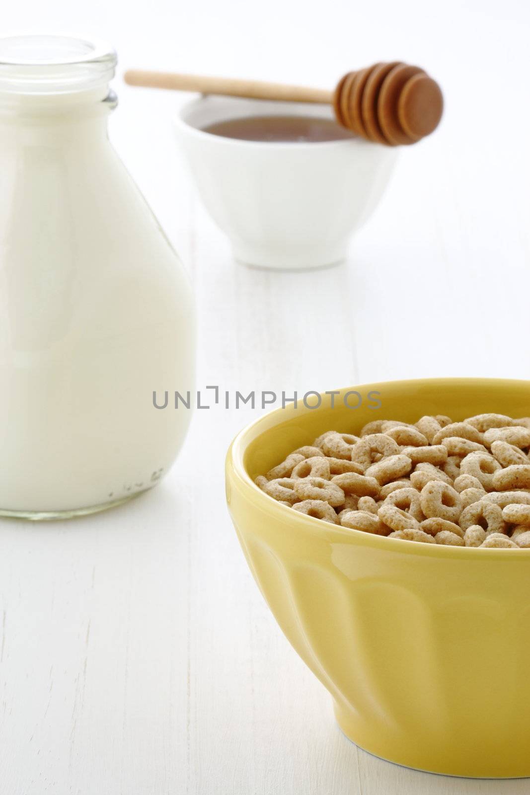 Delicious and nutritious lightly toasted honey, nuts and oats cereal with milk.