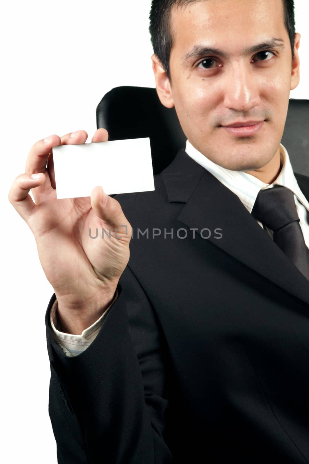 Young businessman showing a blank card