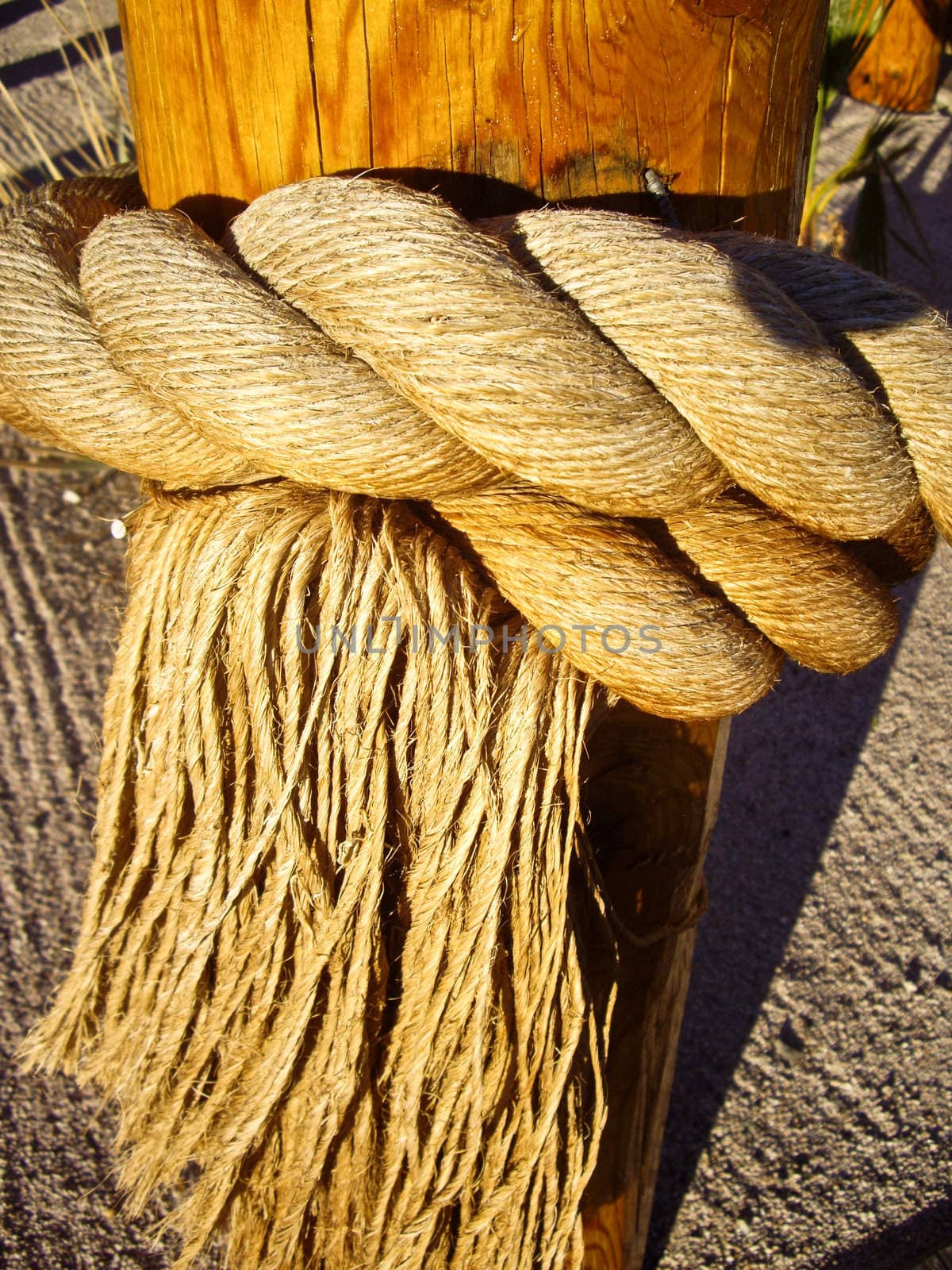 Fringed rope tied on a post