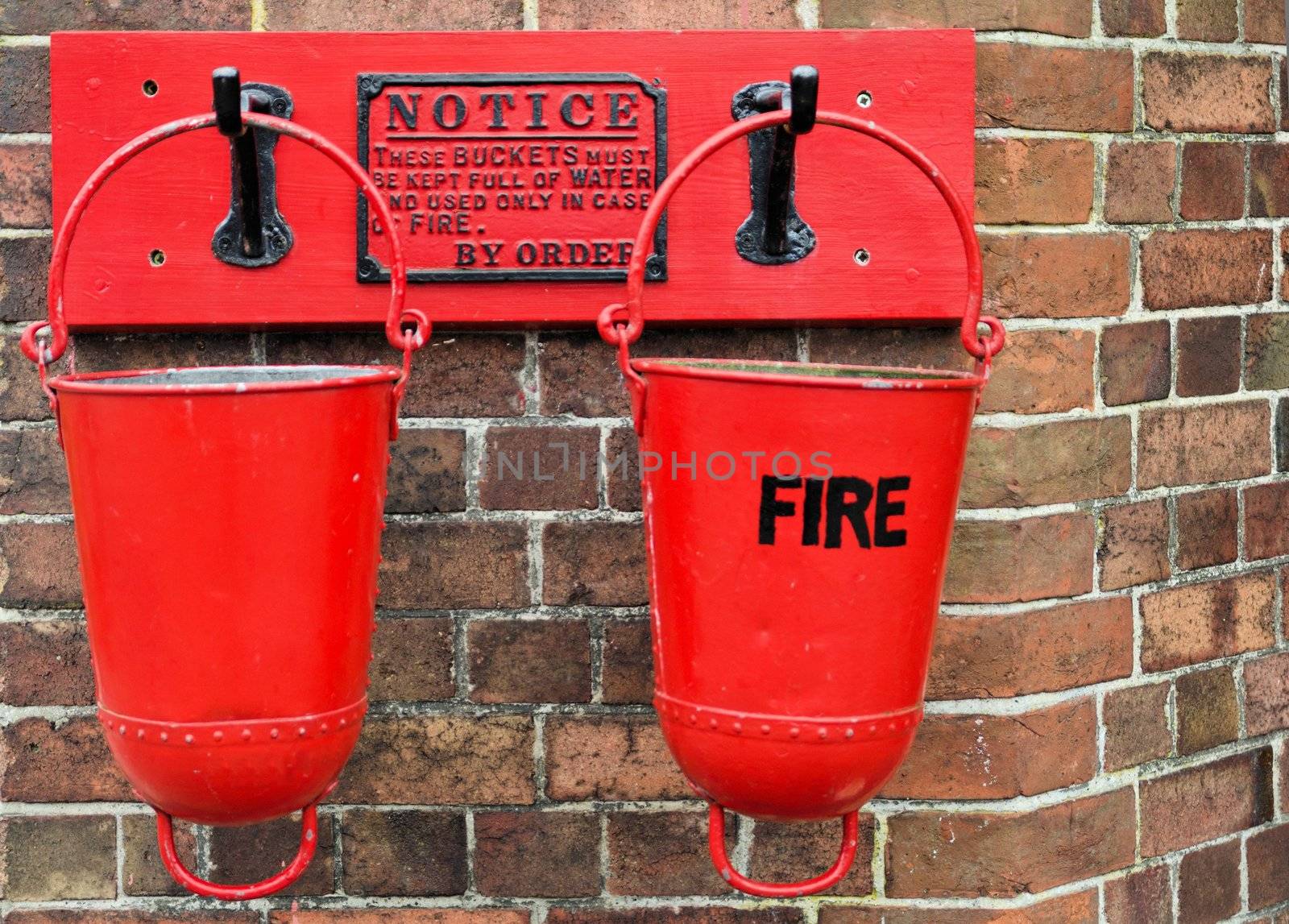 Bright red vintage fire buckets