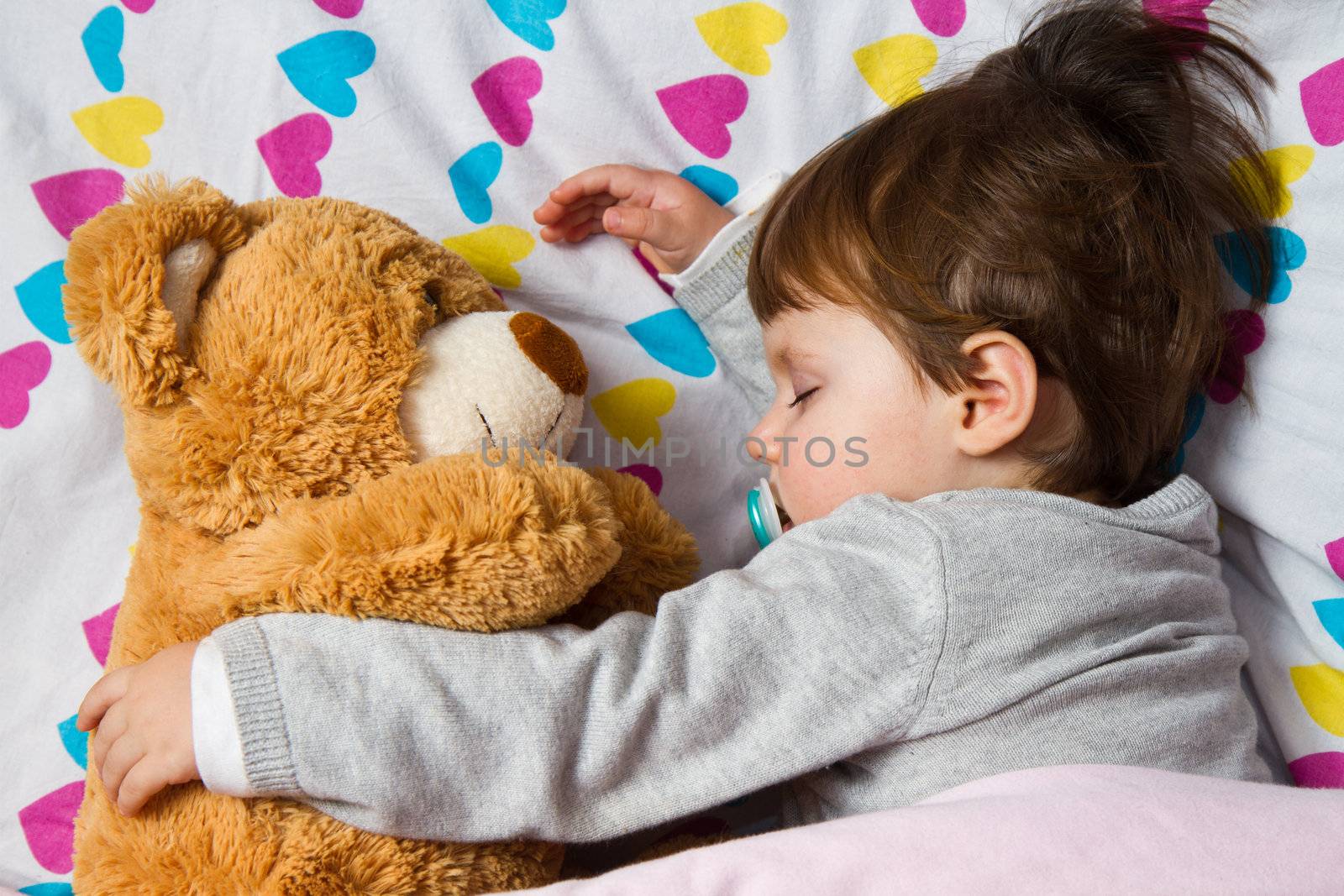 Sweet child sleeping with teddy bear  by lsantilli