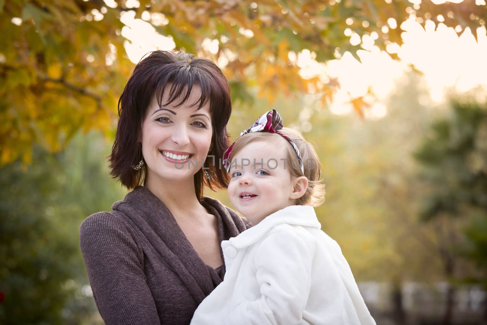 Attractive Mother and Daughter Portrait Outside by Feverpitched