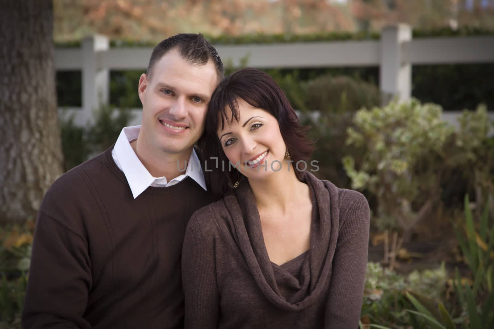 Attractive Couple Portrait in Park by Feverpitched