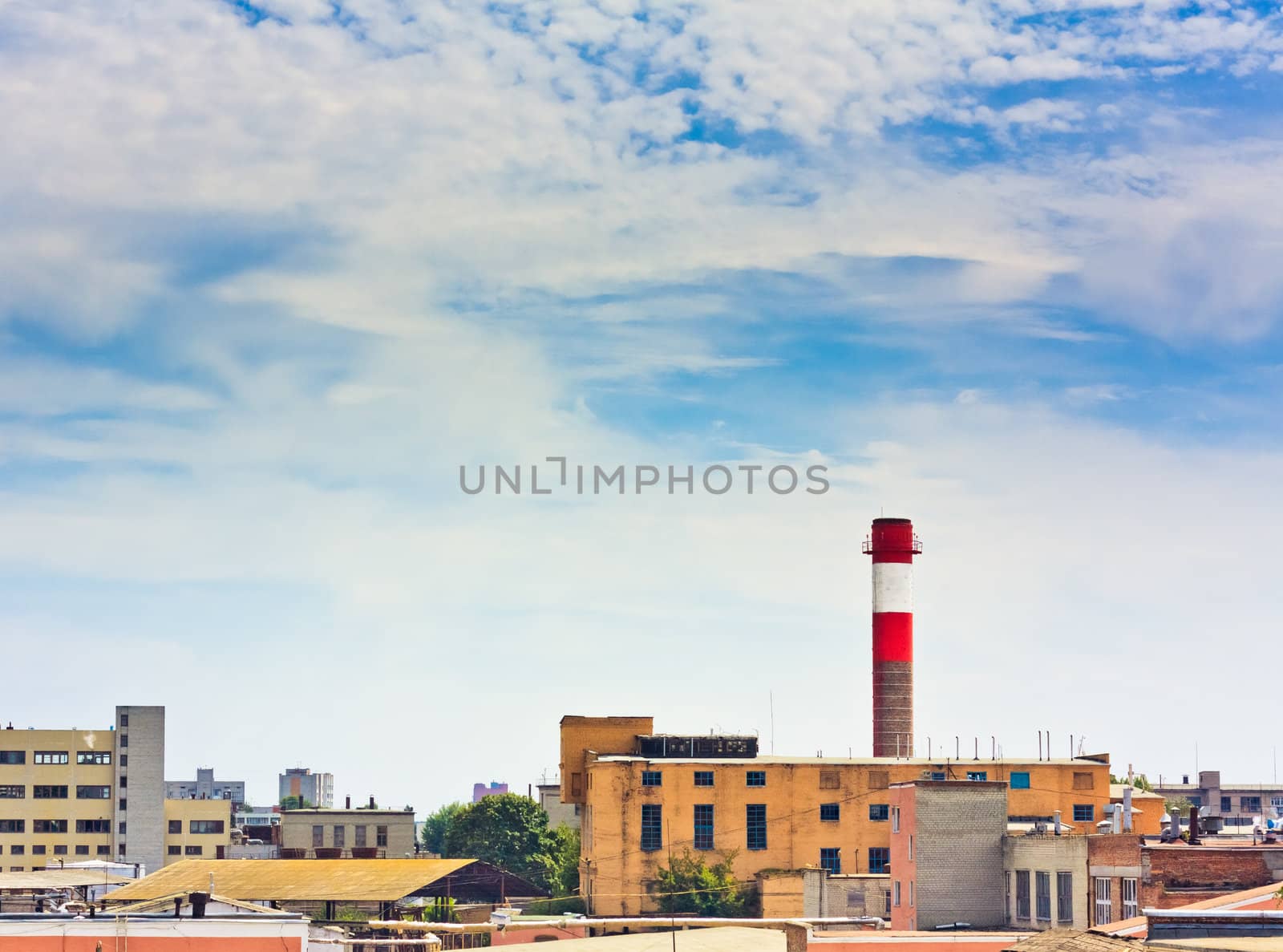 Factory pipe on a background of the blue sky.