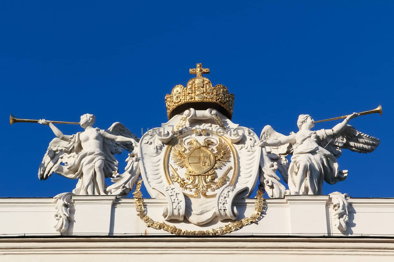 Two angels flanking Austrian insignia of power in the "leopoldinischen trakt" of the Austrian Hofburg