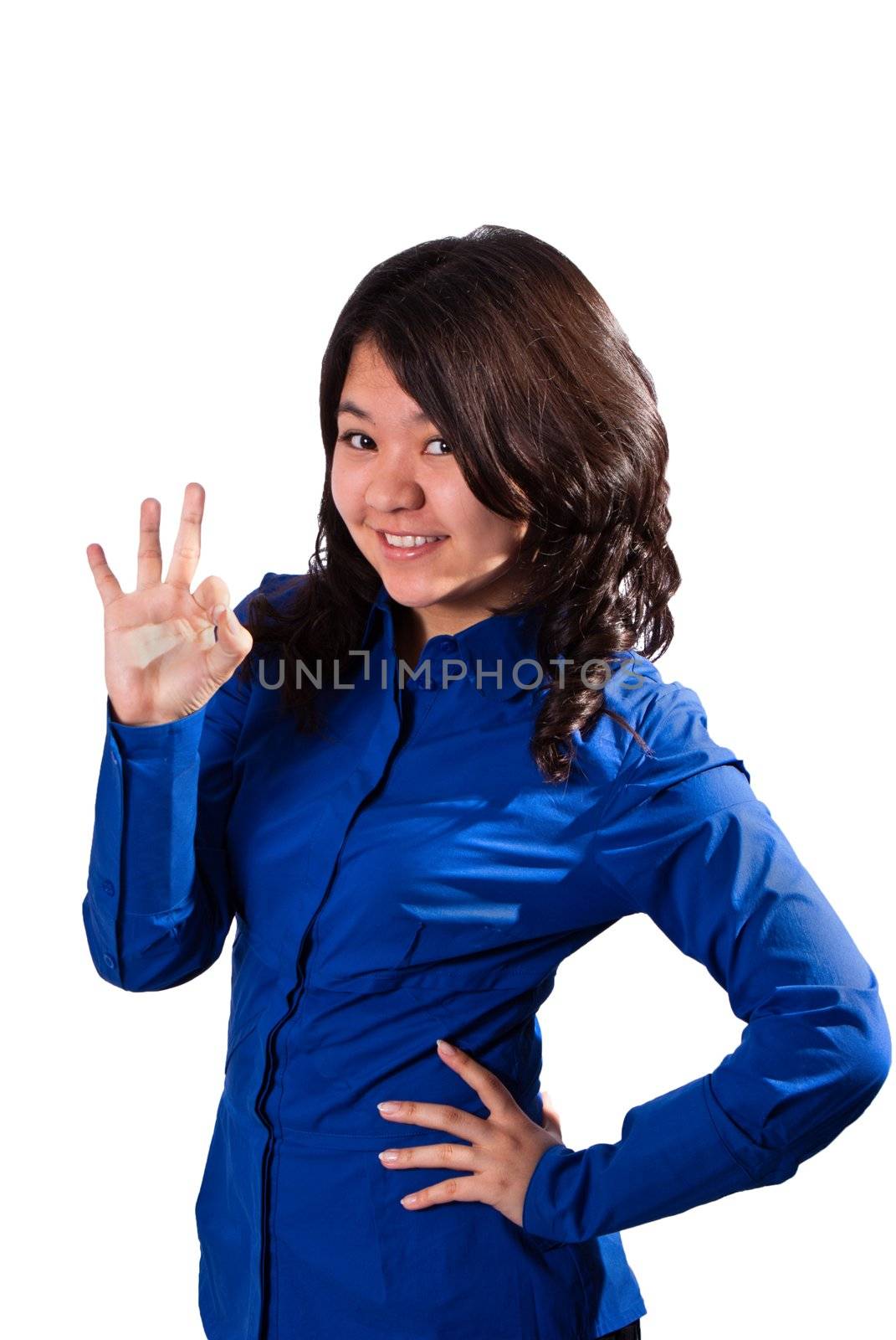 Cute smiling asian girl giving OK sign