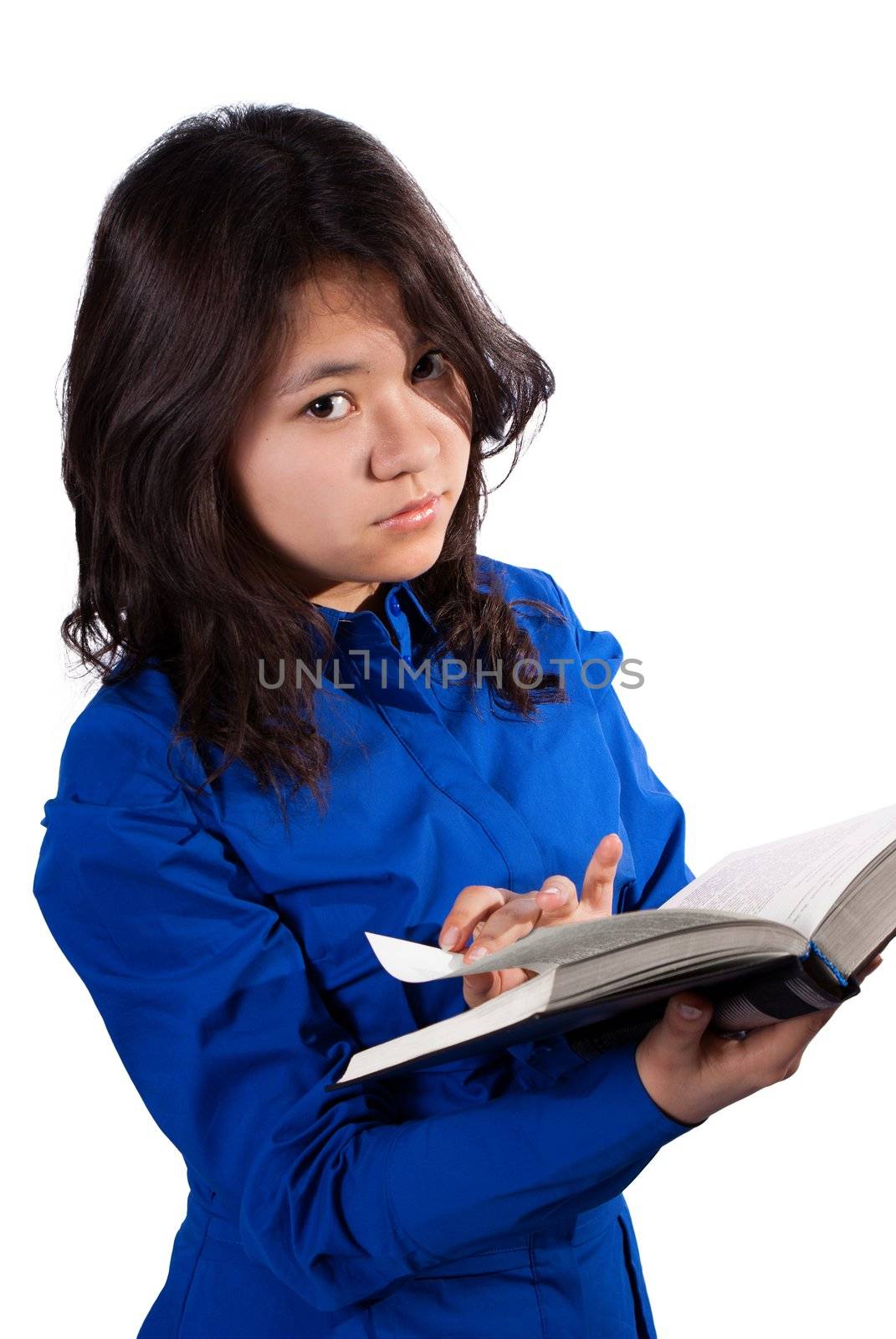 A cute girl reading a book isolated on white