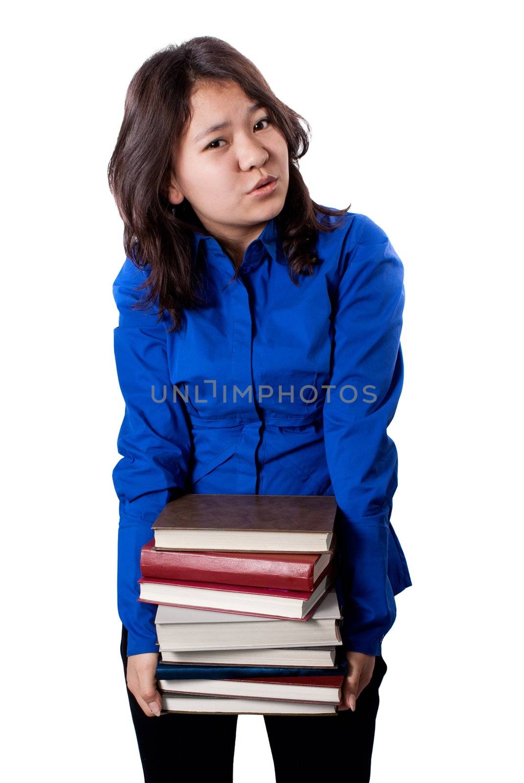 Asian girl holding large stack of books, isolated on white