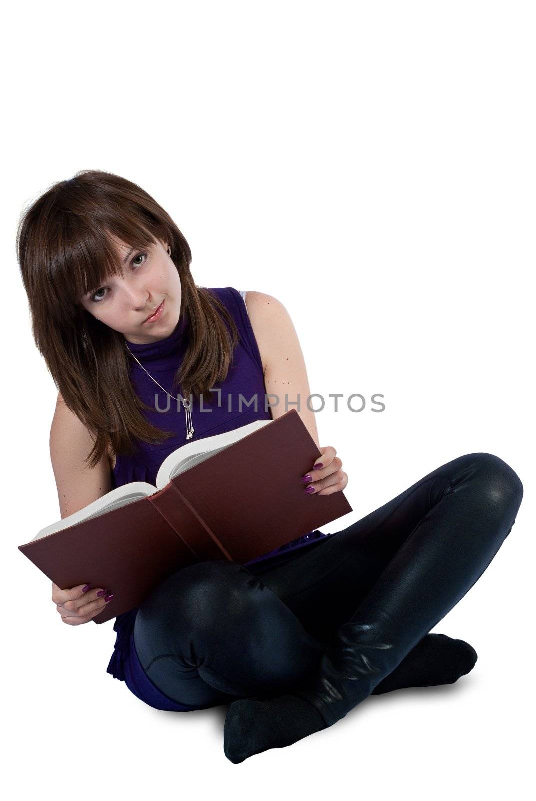 Cute girl reading a book isolated on white