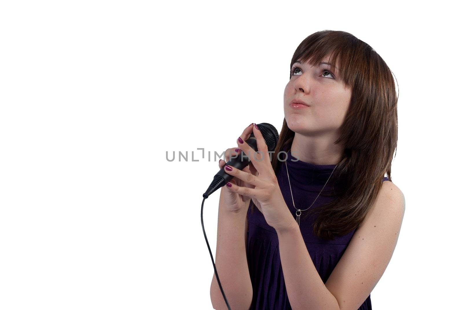 Cute girl singing into a microphone on a white background