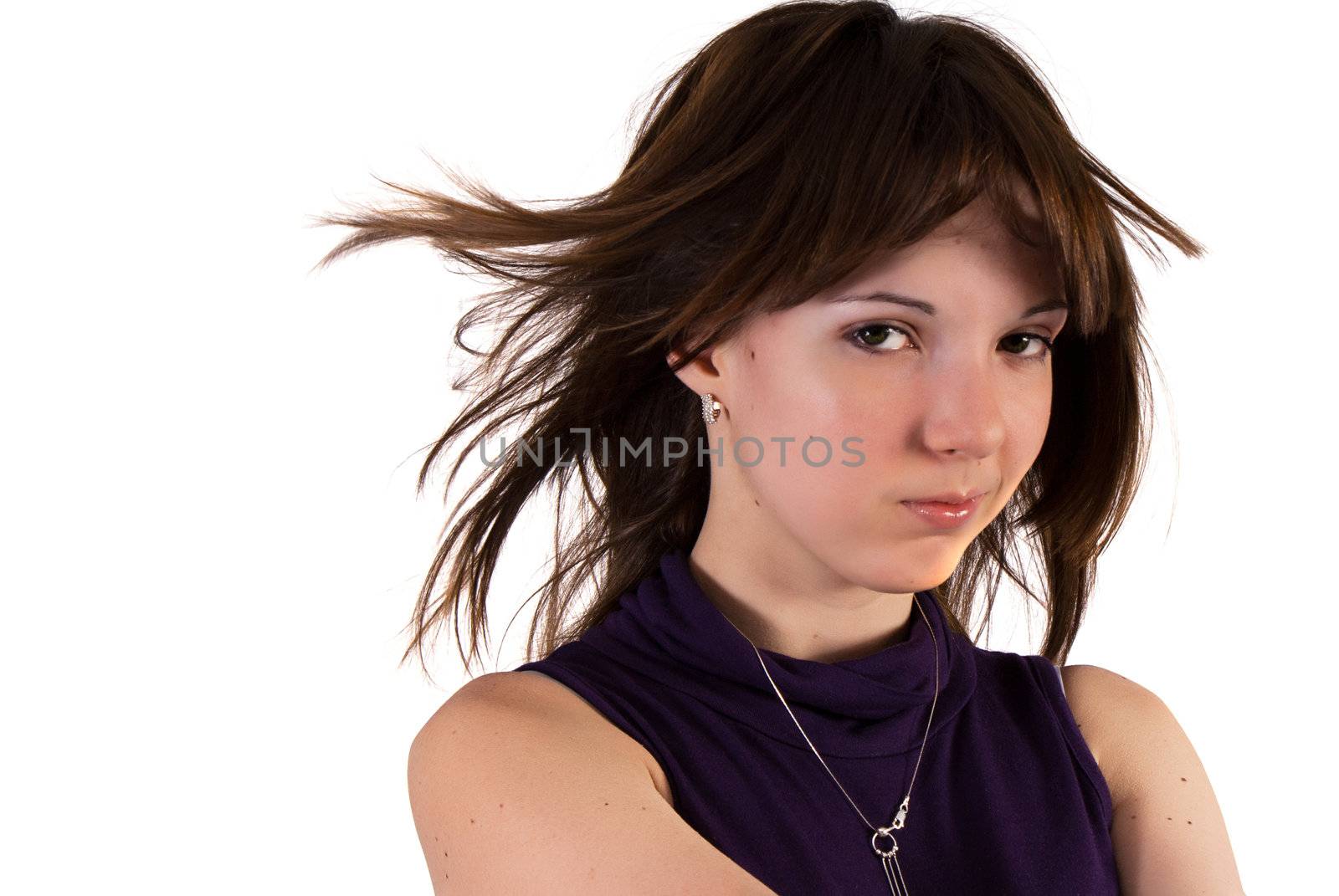 Young girl with wind blown hair, isolated on white