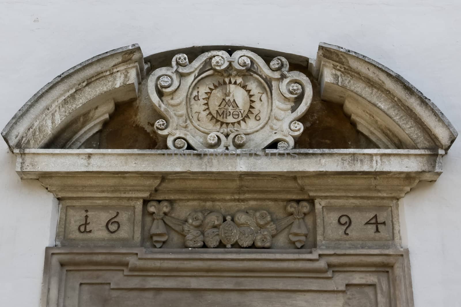 A detail of a door to a public catholic school in lower austria
