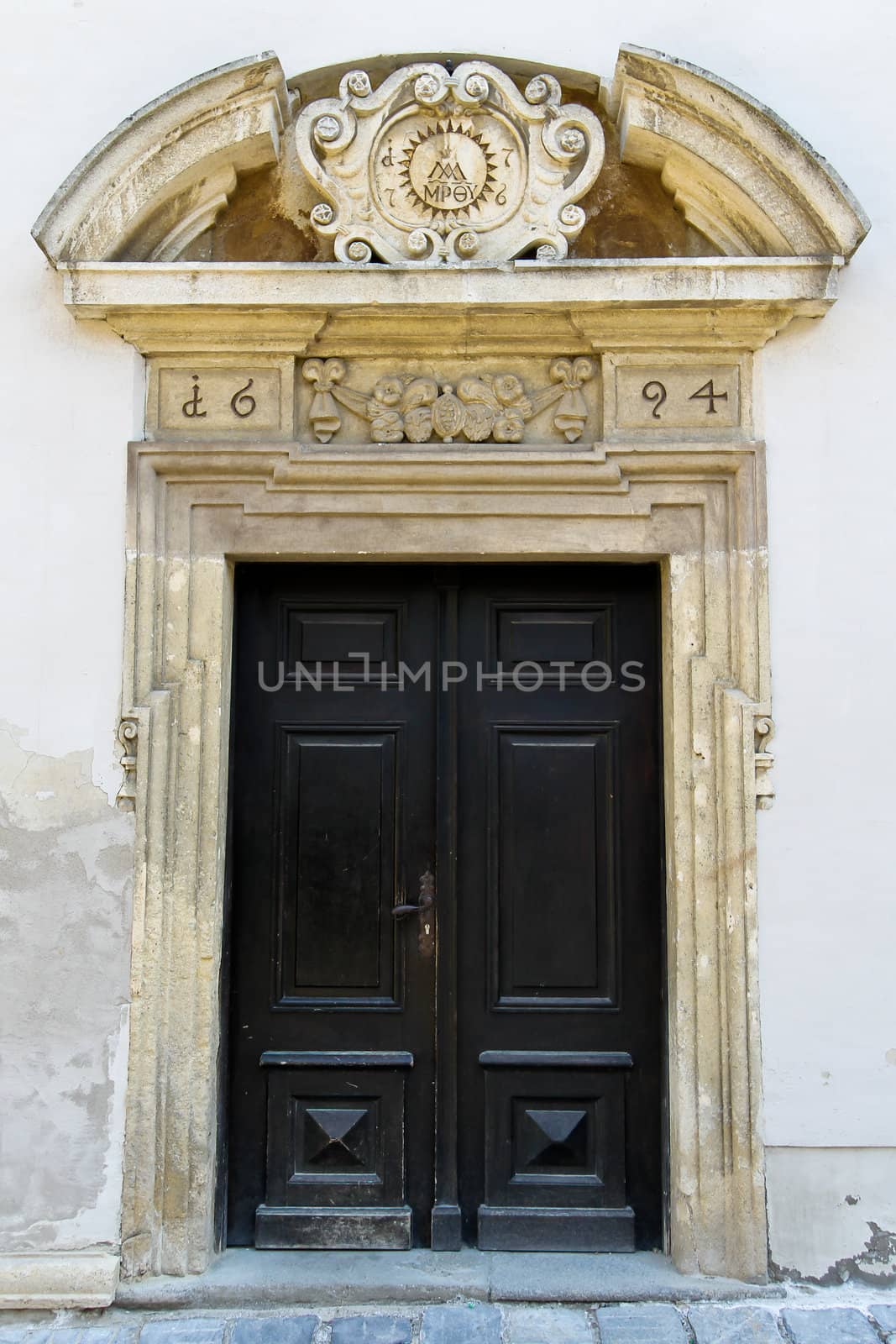 An old entrance to a public catholic school in lower austria