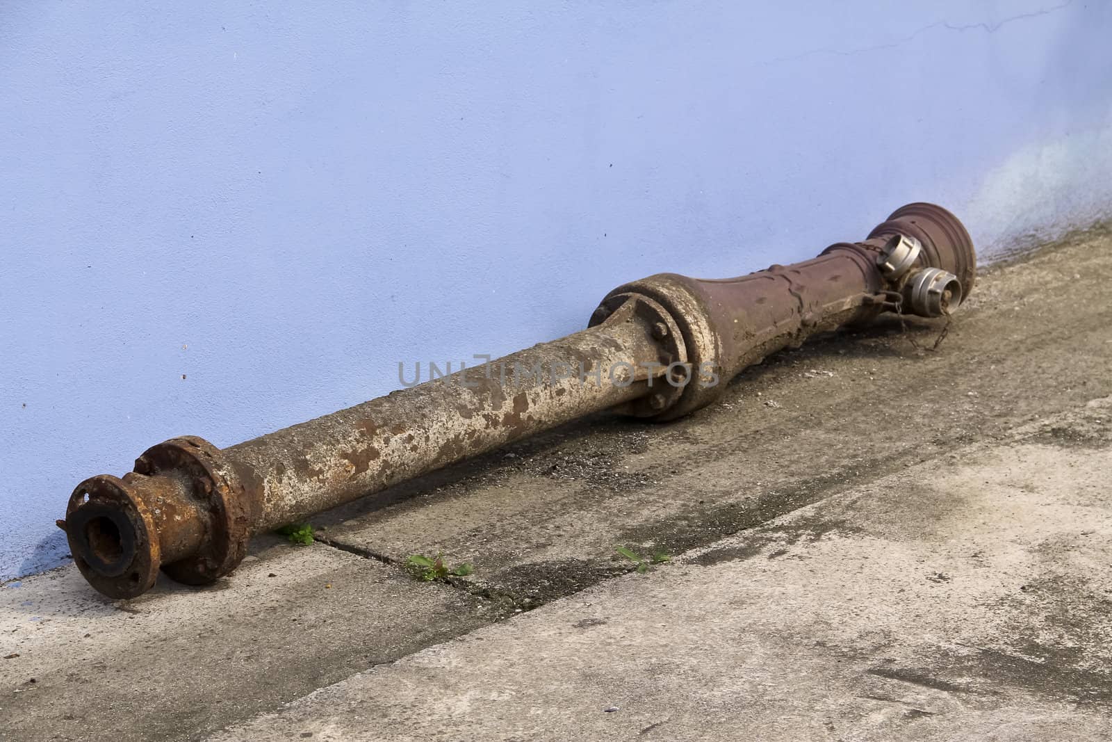 An old pipe lying on the floor, waiting for being disposed