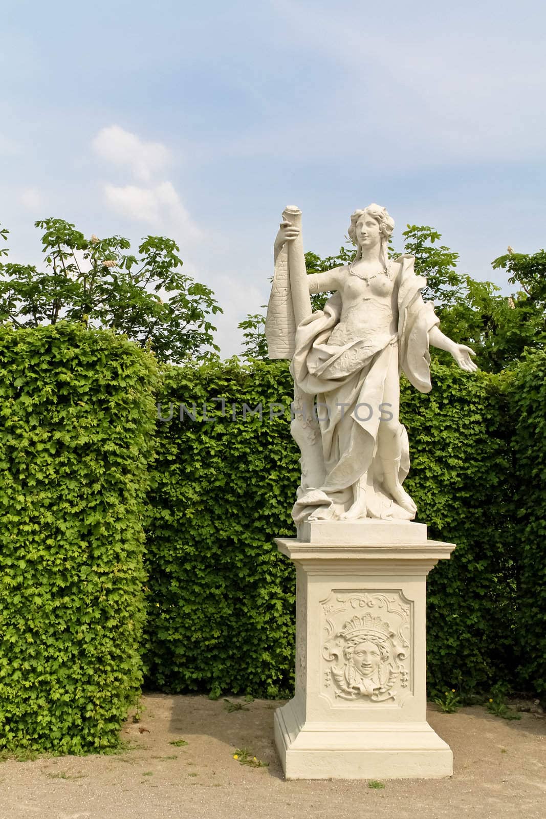 A bare breasted statue in the park of castle Belvedere in Vienna, Austria