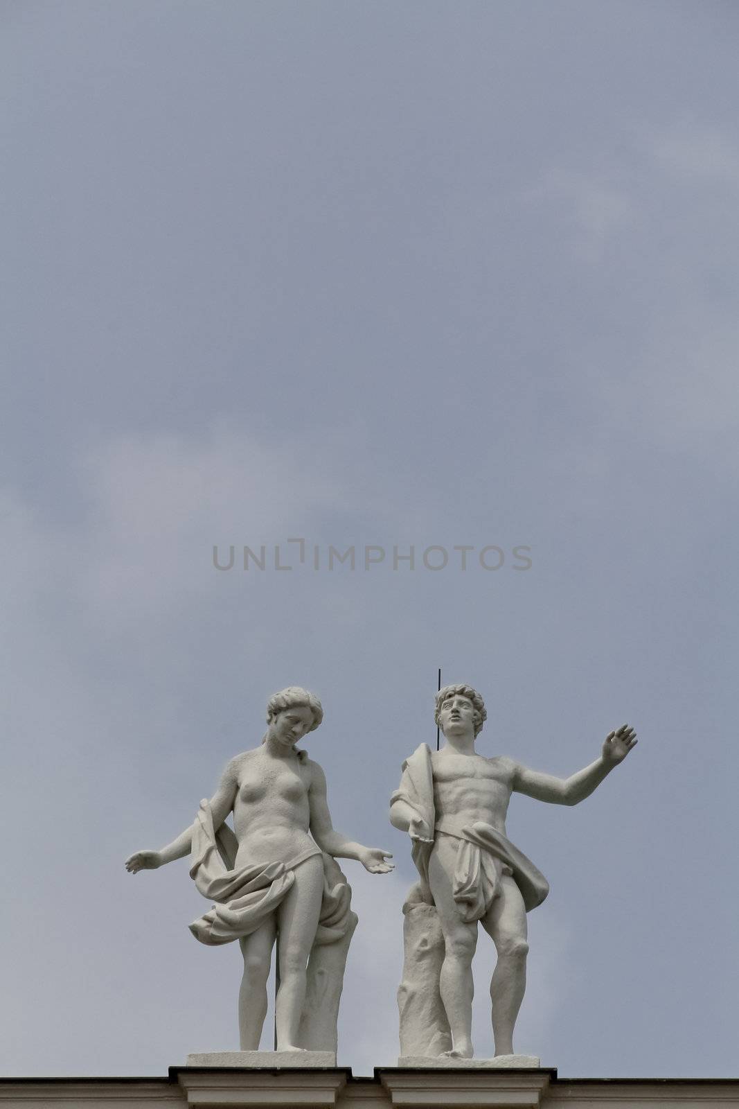 Two statues on castle Belvedere in Vienna, Austria