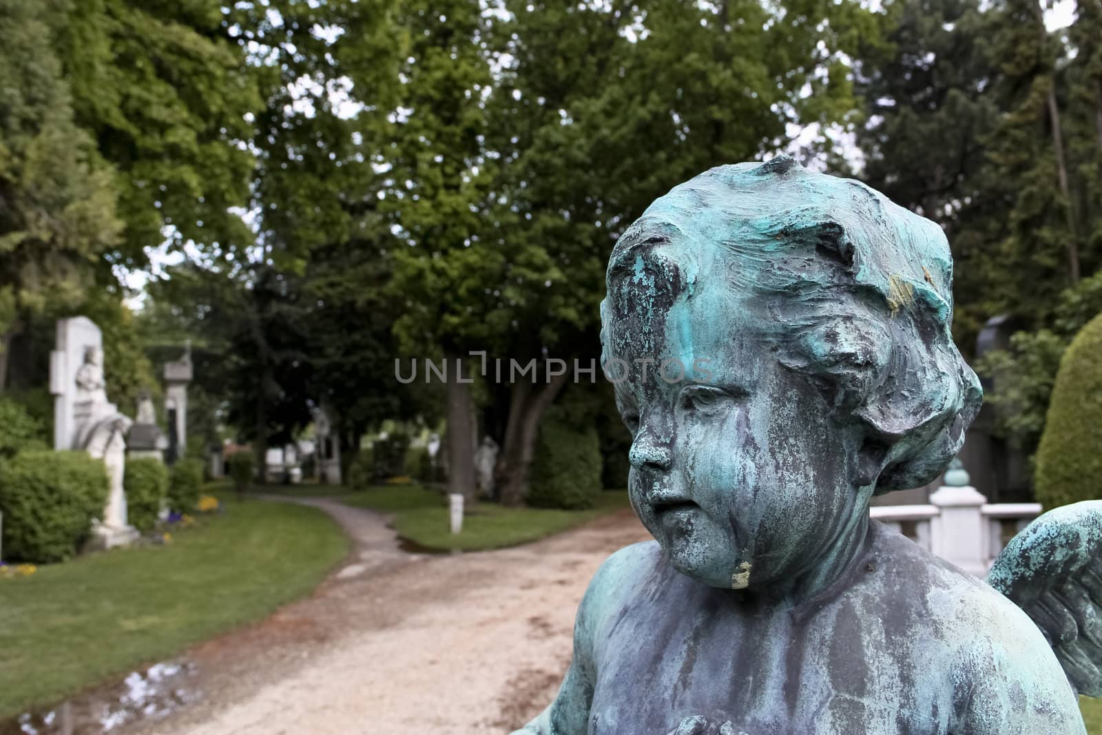 A baby angel at the entrance to Vienna's central cemetery