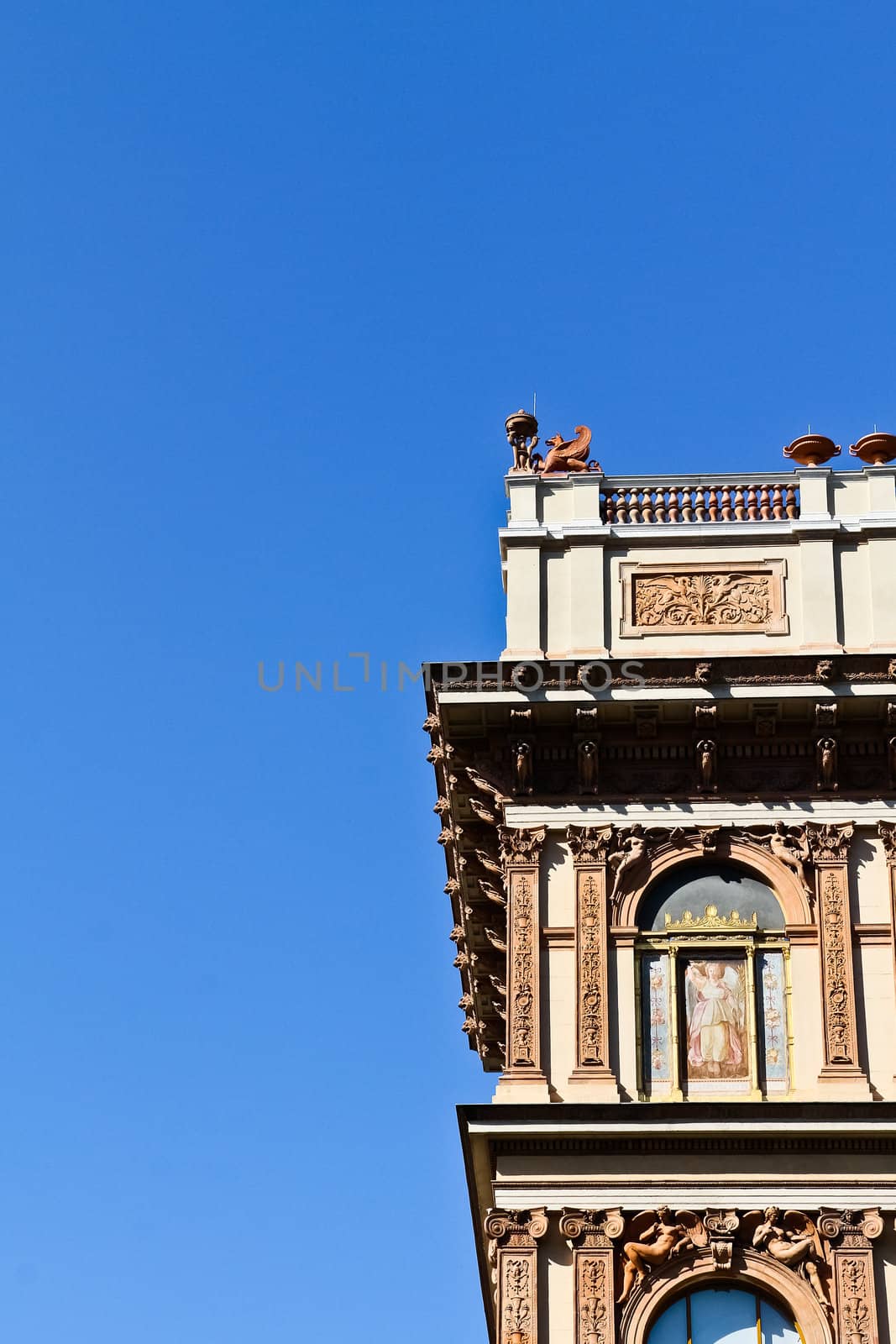 A winged beast guarding an imperial building with a beautiful facade