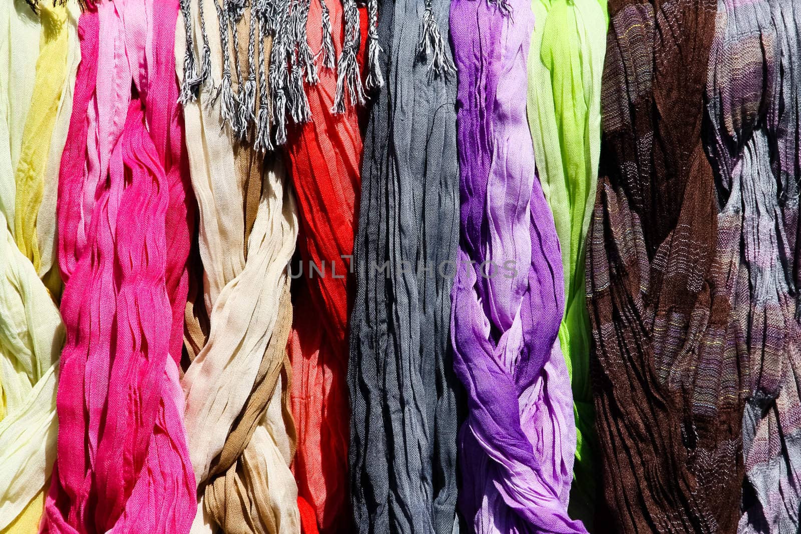 A set of scarves on a flea market with strong colors