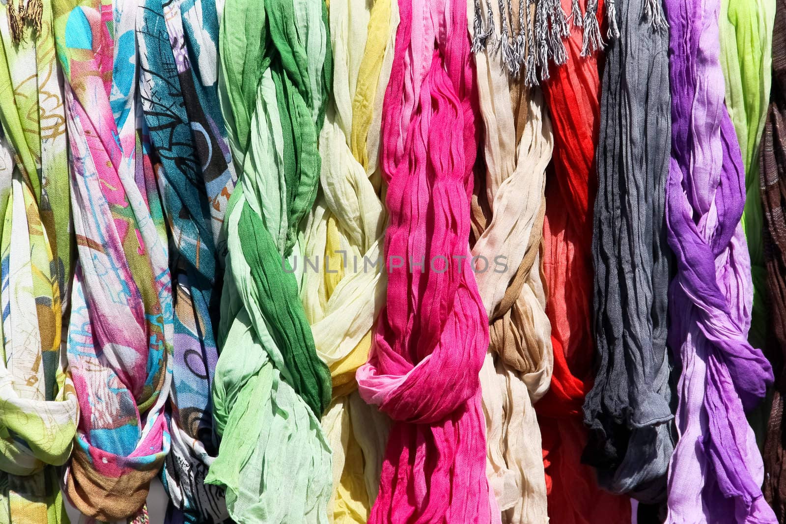 A set of scarves on a flea market with strong colors