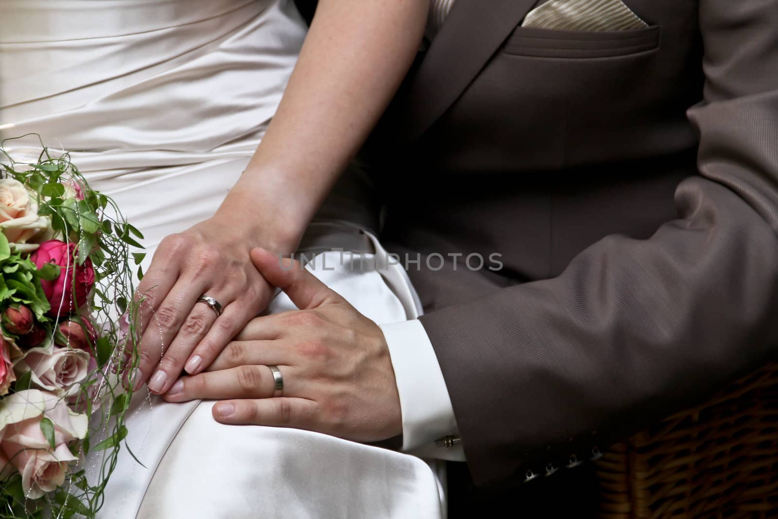 Detail of a married couple posing for a photo