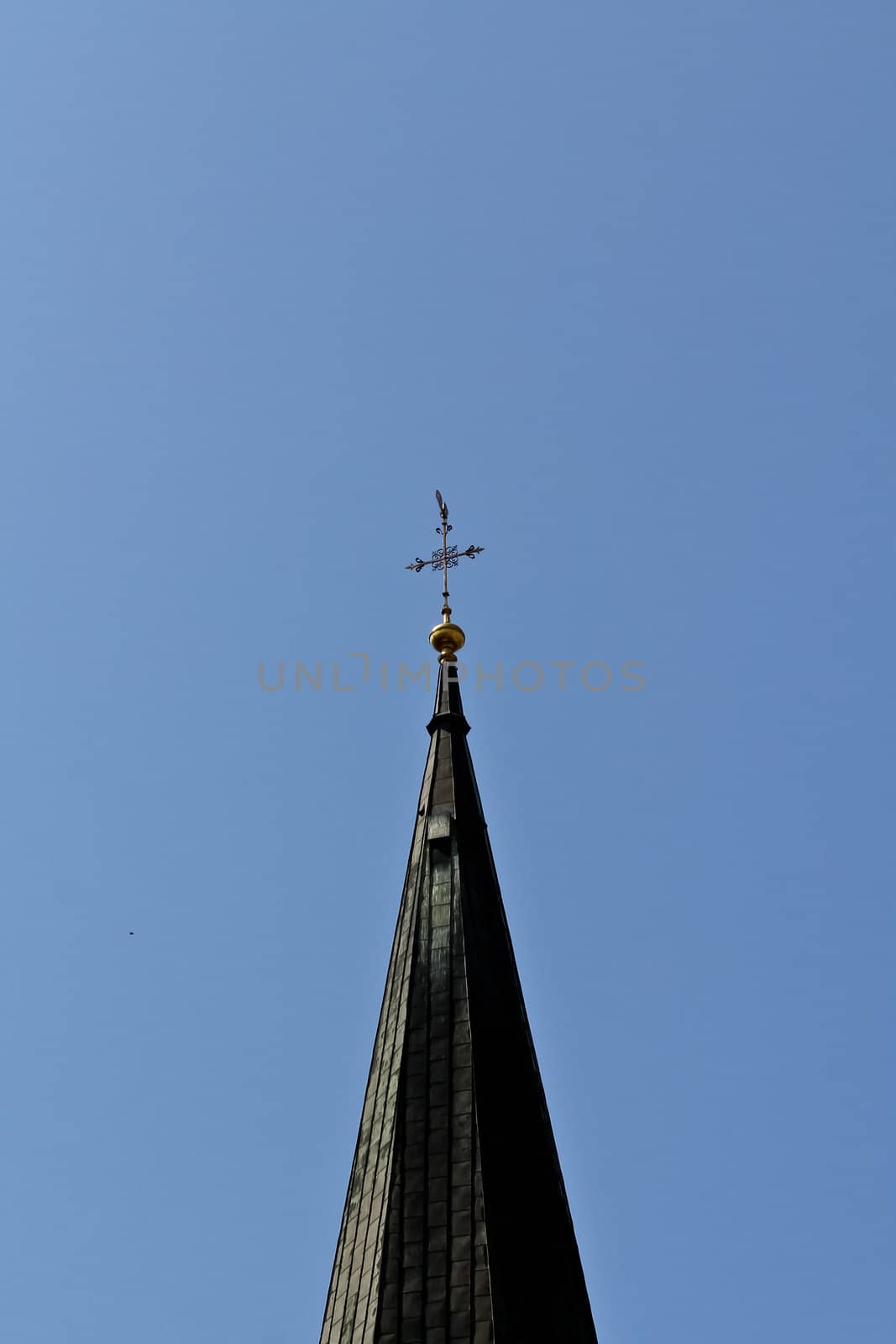 The top of a church tower in the center of Vienna, Austria