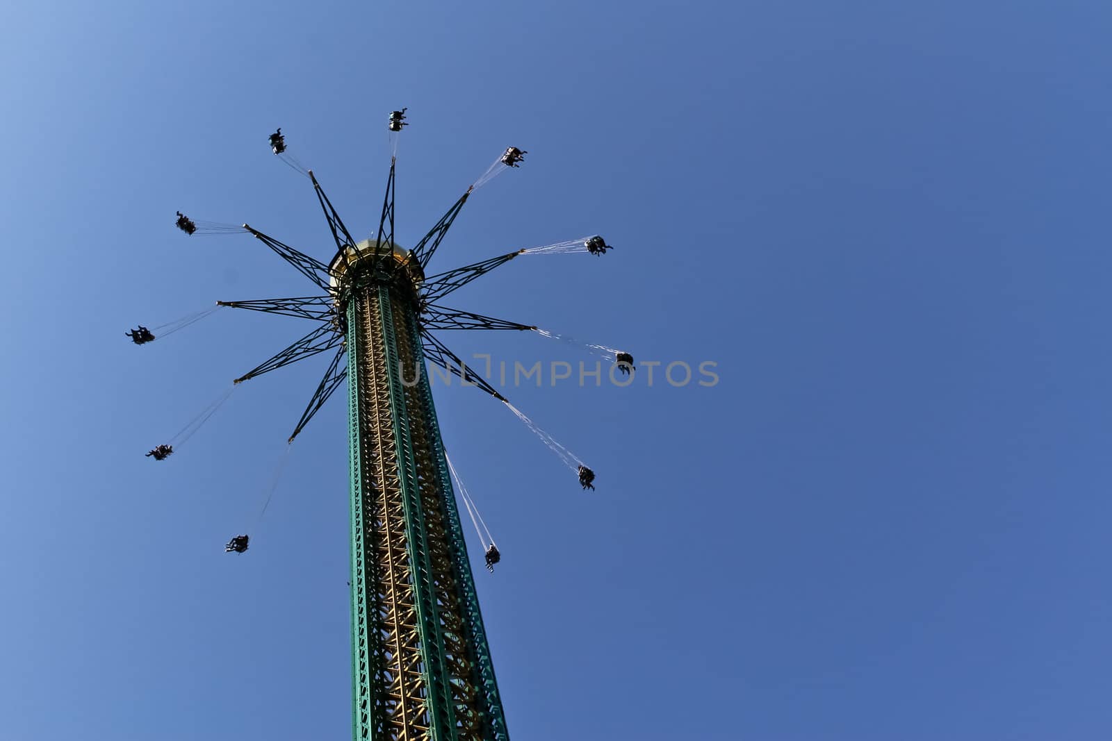 A carousel high up in the air in an amusement park in Vienna