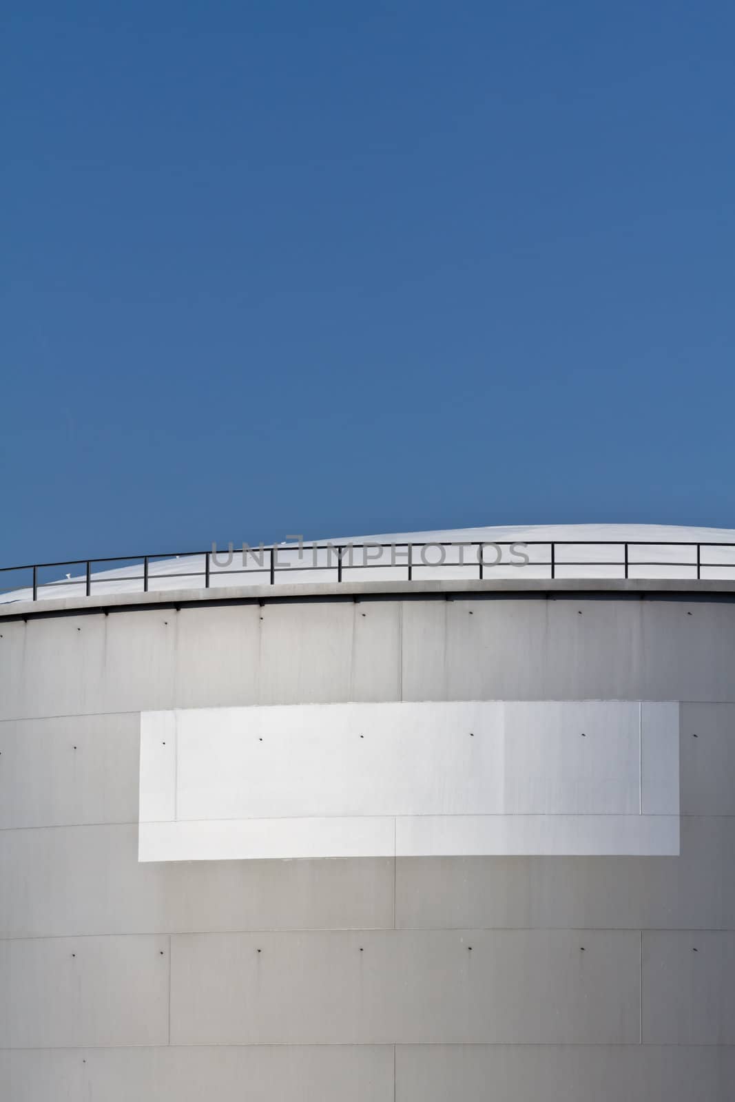 An industrial tank with a blank white label on it