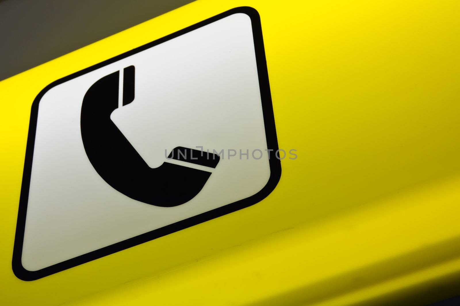 A lighted sign for a telephone booth at the airport of Vienna