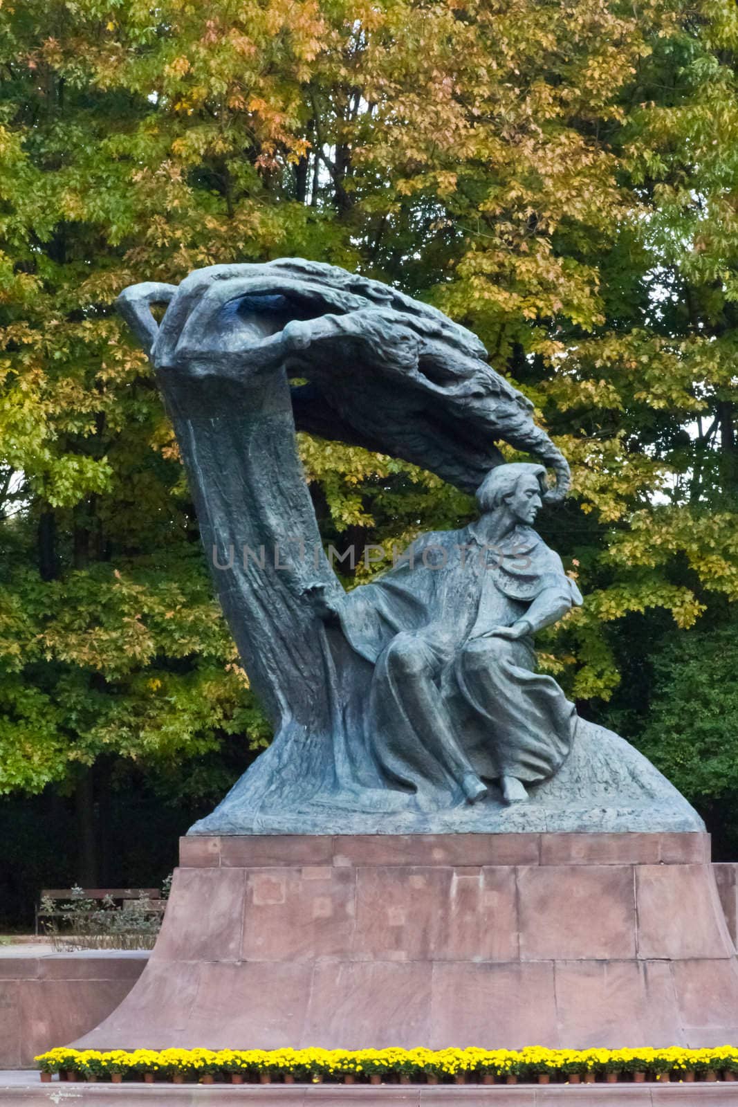 A statue of Frederic Chopin, the polish composer, in a park in Warsaw, Poland