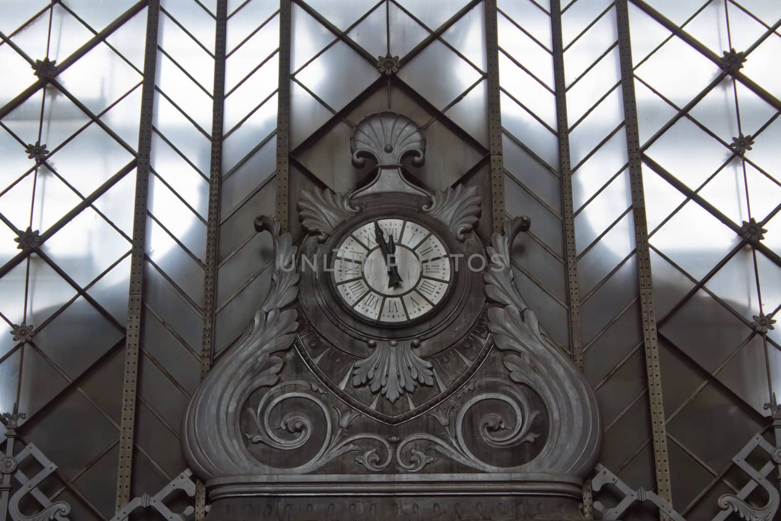 An old large clock at the central station in Madrid