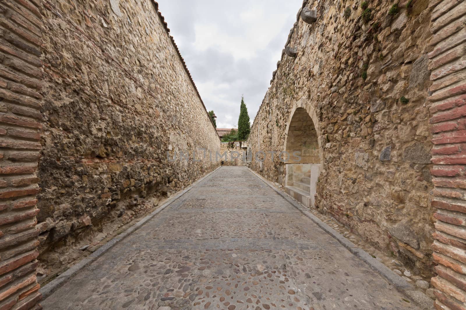 A stone corridor in the city of Segovia, Spain