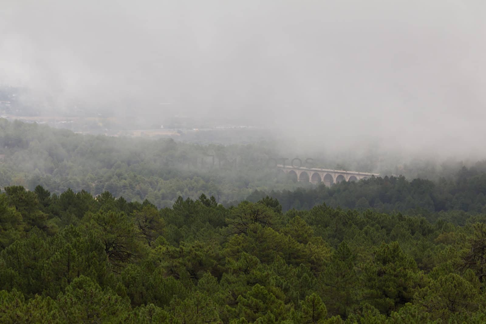 A bridge in the valley of fallen heroes (close to Madrid, Spain) in the fog