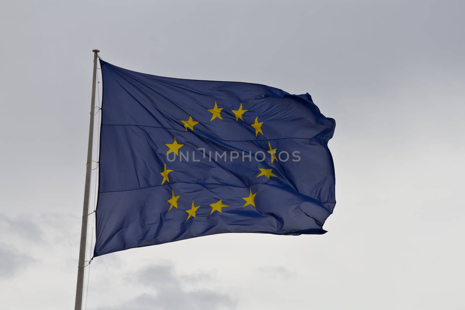 A european union flag waving on a square in Madrid