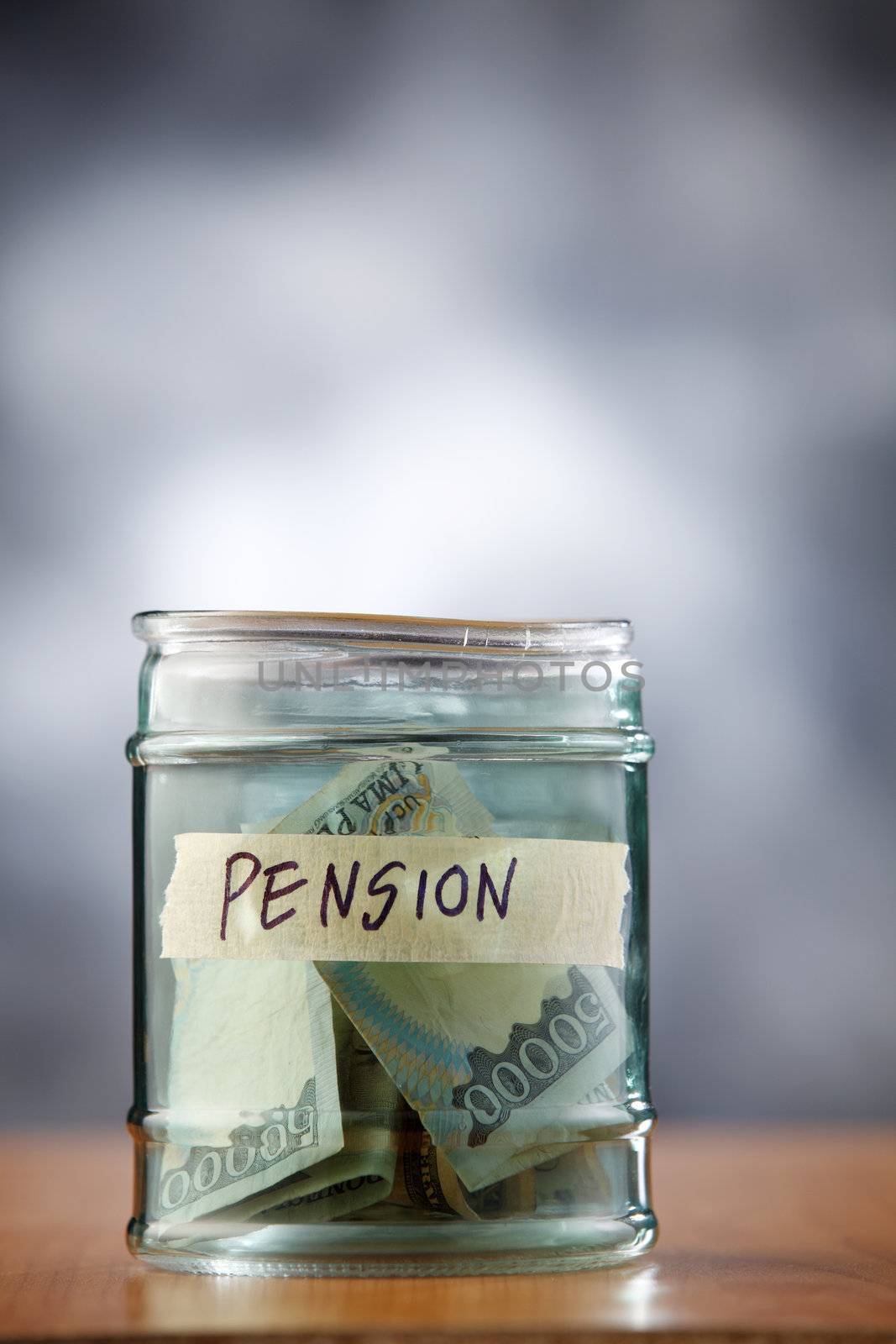 A jar of cash on the table.