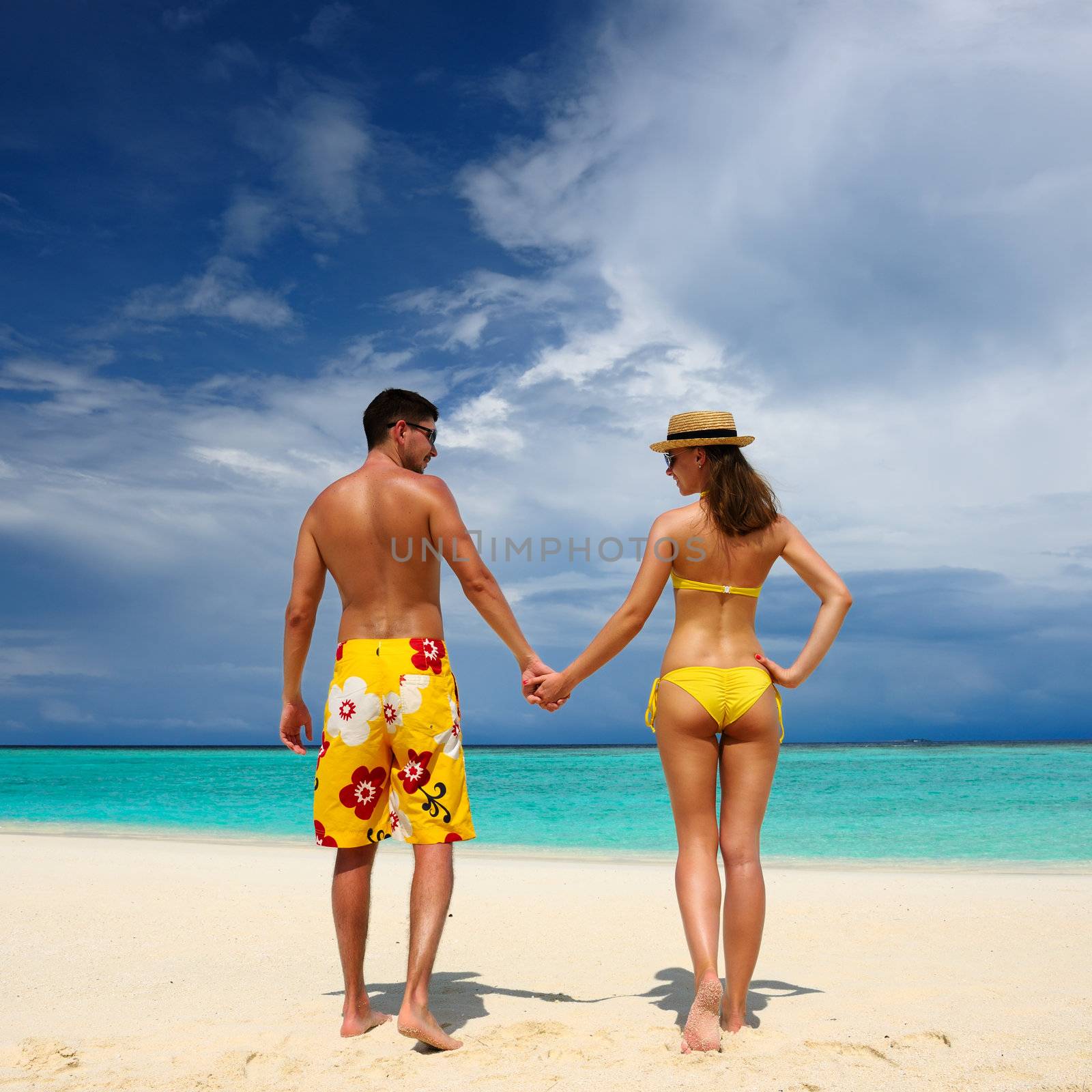 Couple on a tropical beach at Maldives