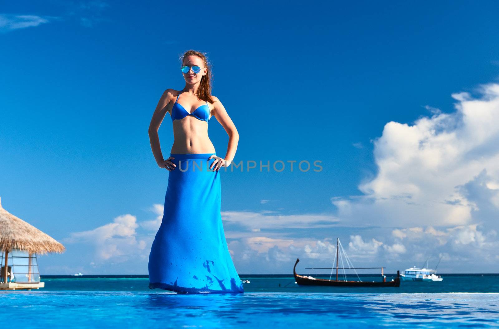 Woman in skirt at the pool 