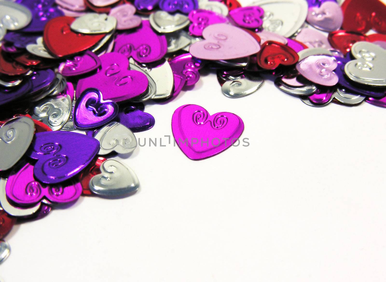 decorative hearts laying on white background