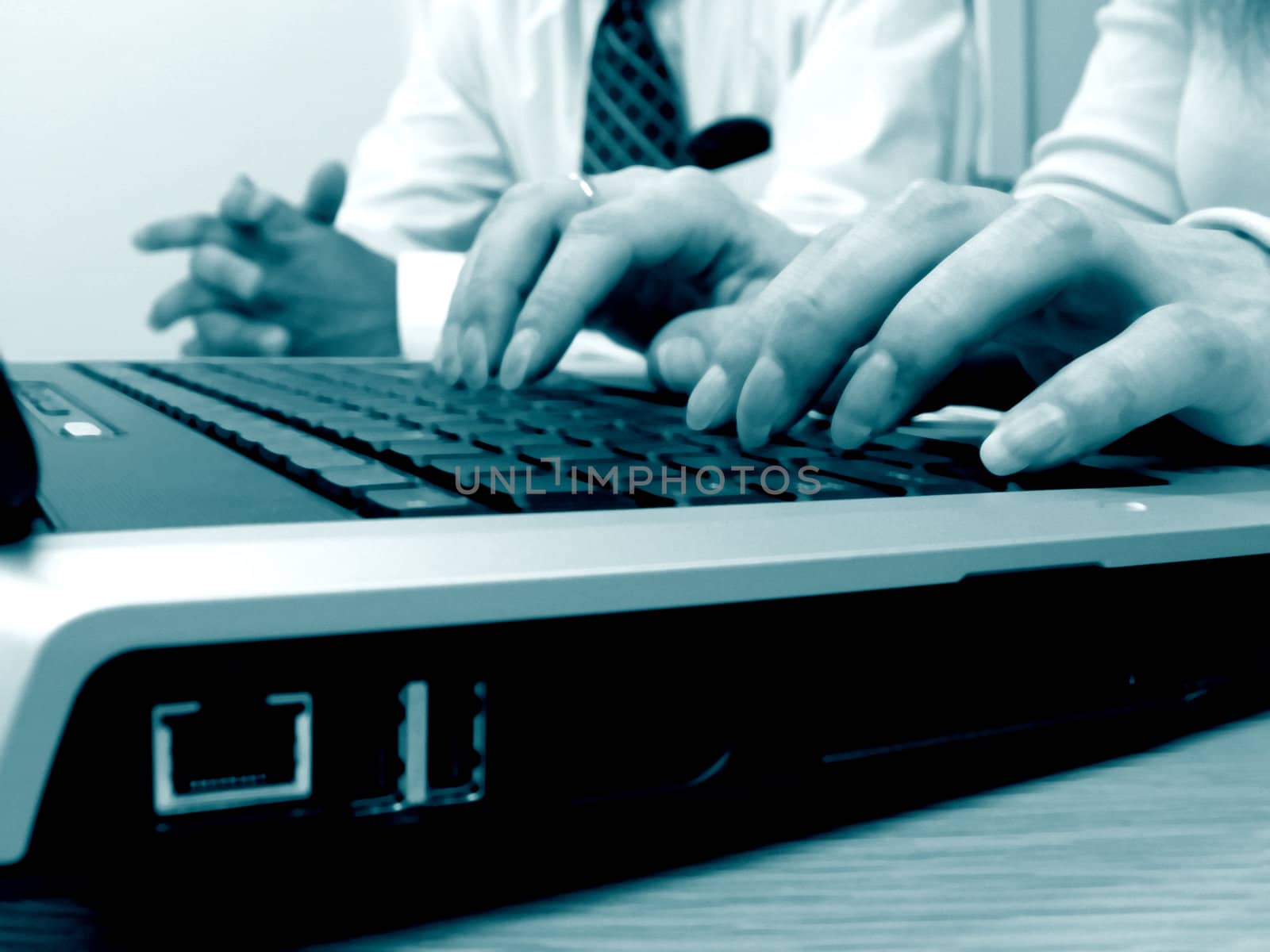 business man typing on laptop