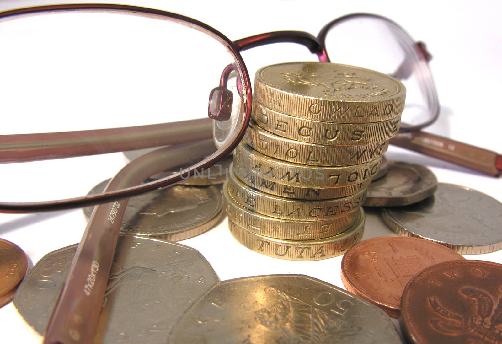 close up of coins and eys glasses