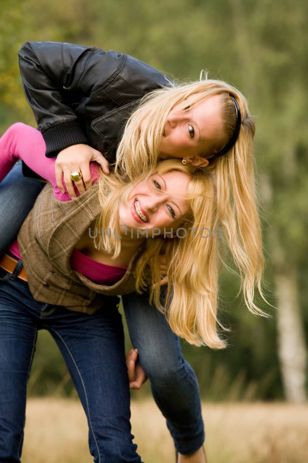 two sisters in a park having fun