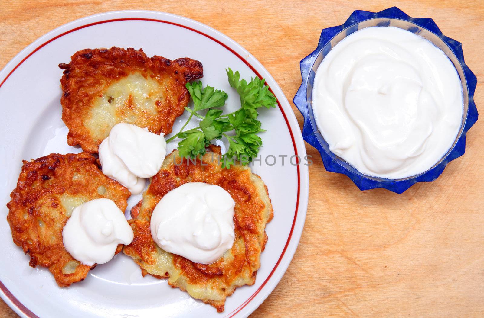 potato pancakes with sour cream by Mikko