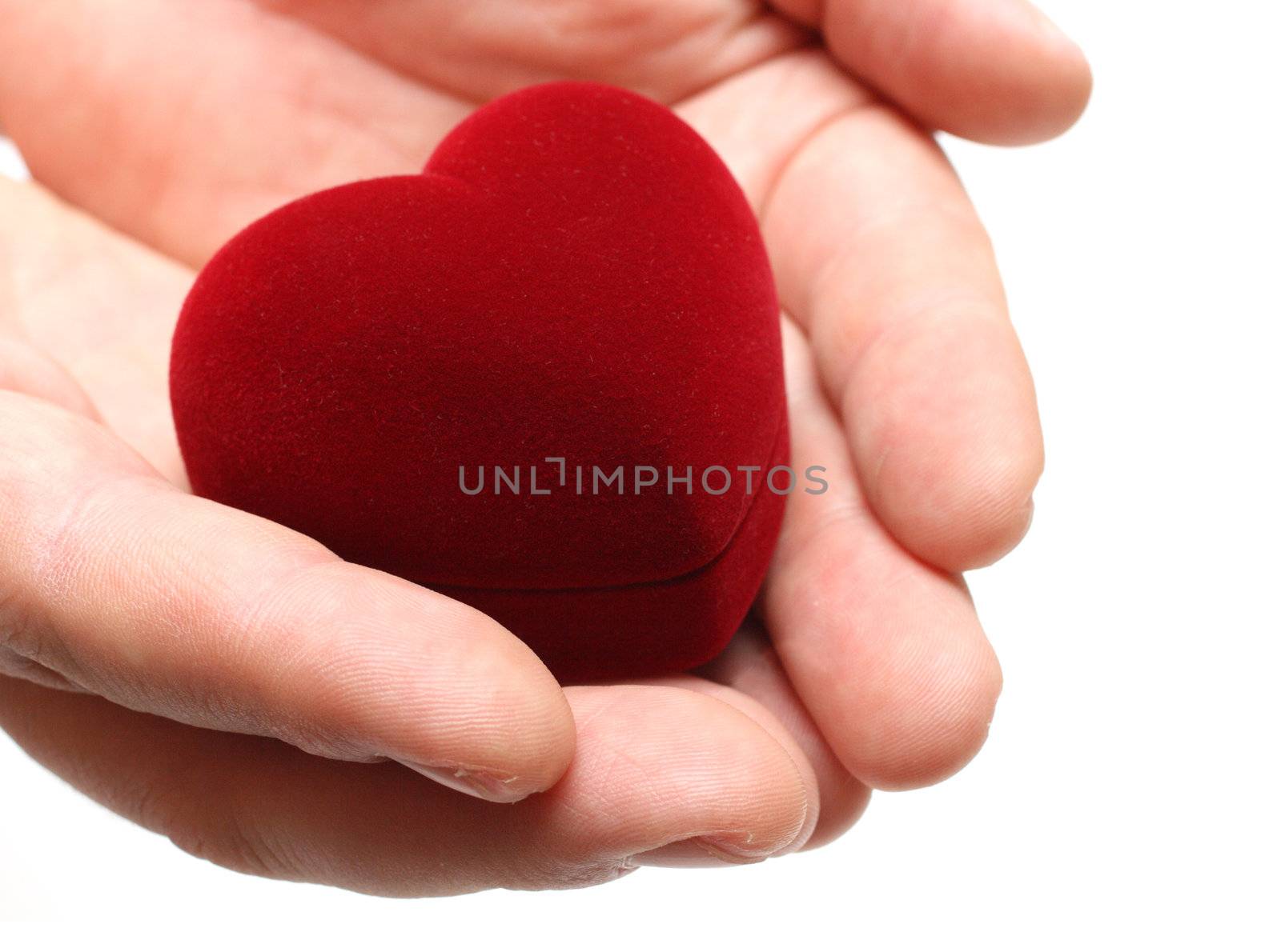 man's hands gifting heart on valentine day by Mikko
