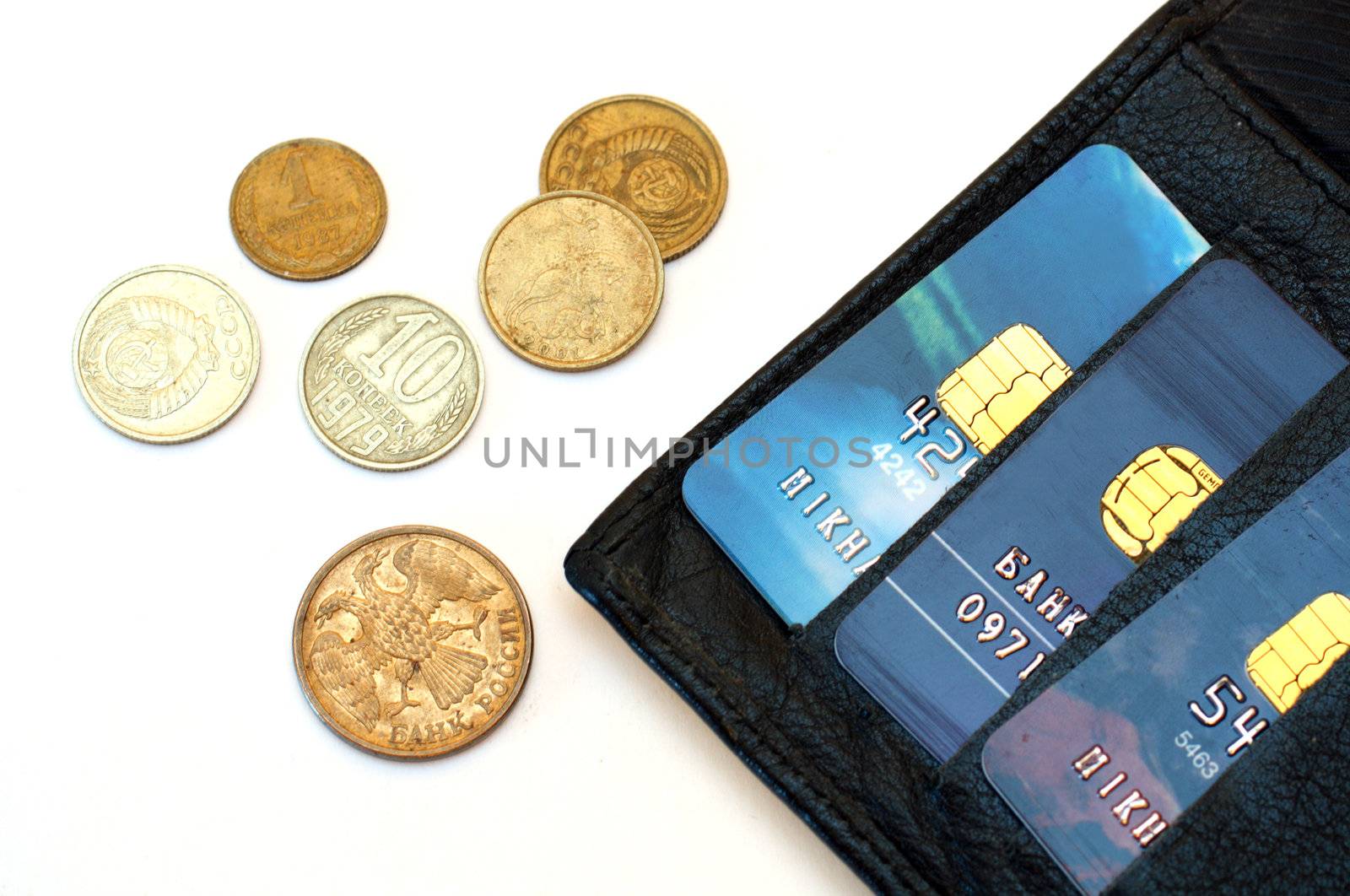 coins and plastic cards in black wallet