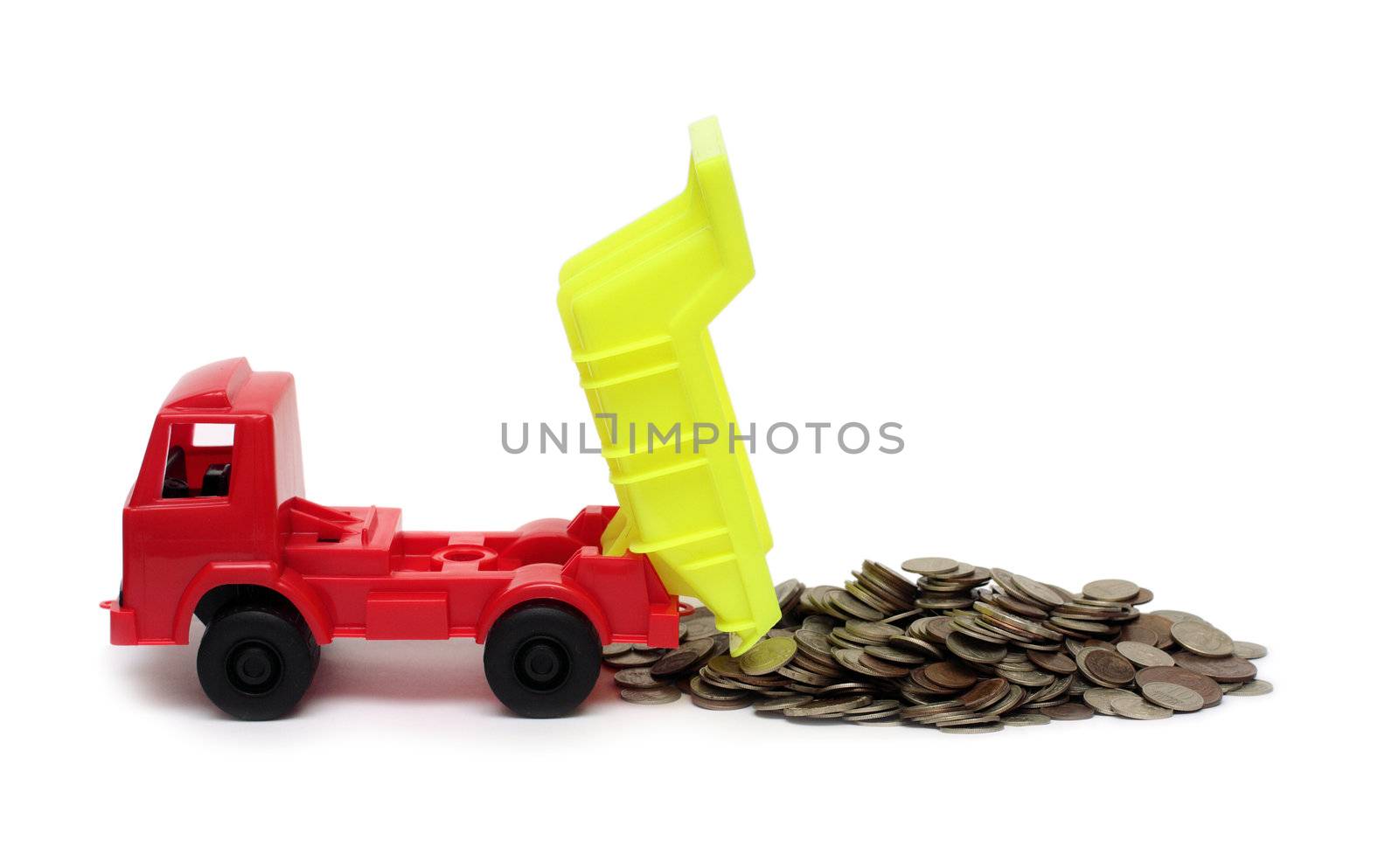 toy lorry and strew coins - business concept