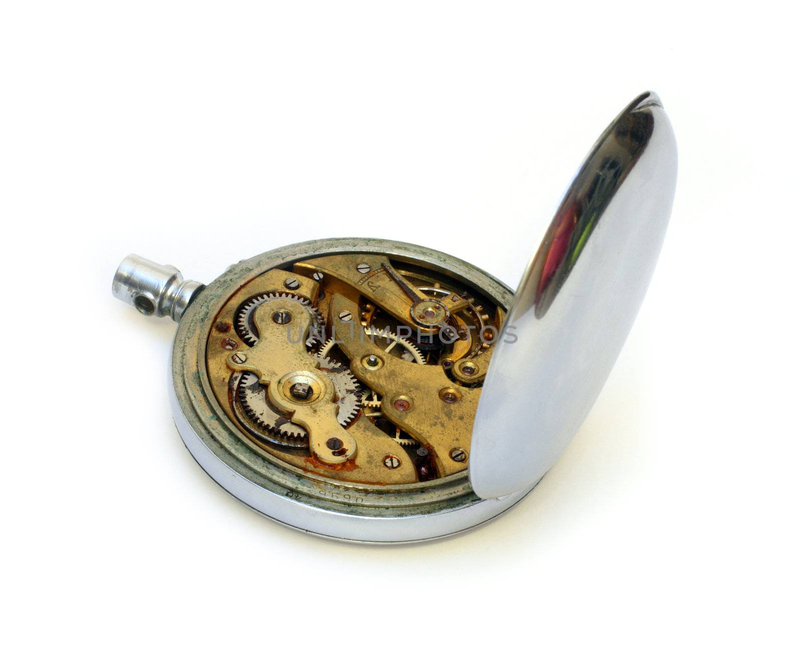 old pocket watch with open cover of gear isolated on white