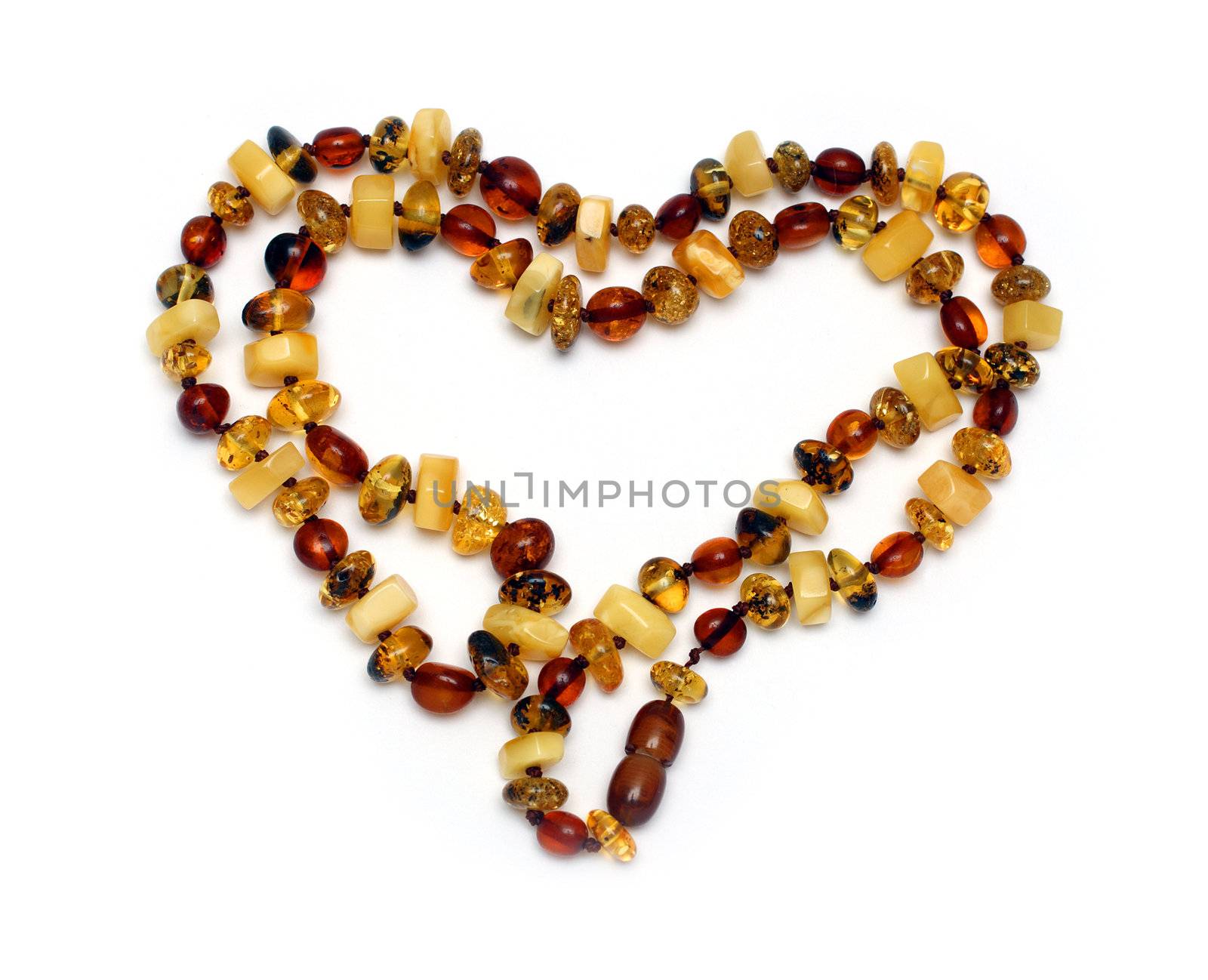 heart shape from amber necklace isolated on white