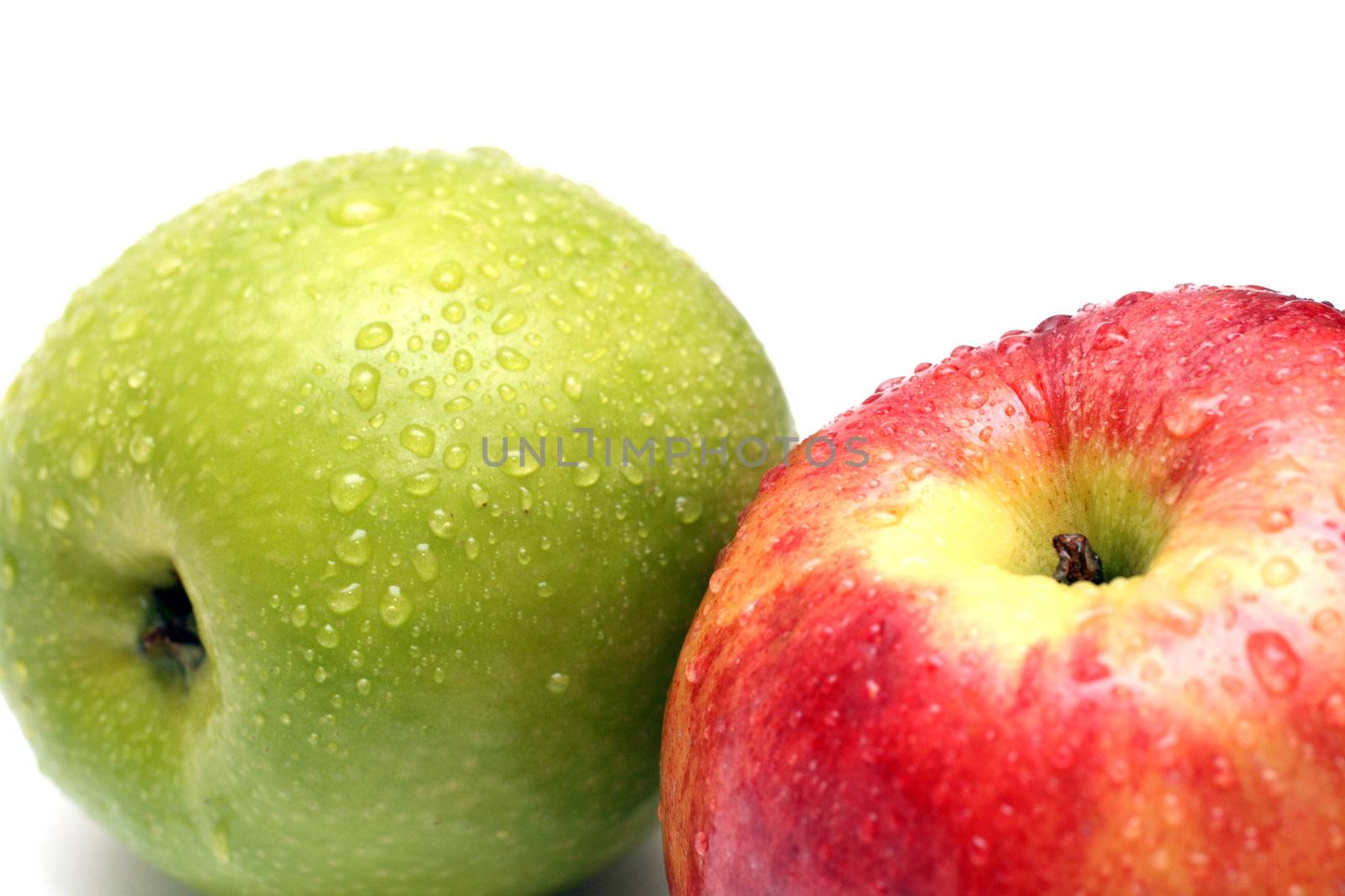 wet green and red apple fruits with water drops close-up