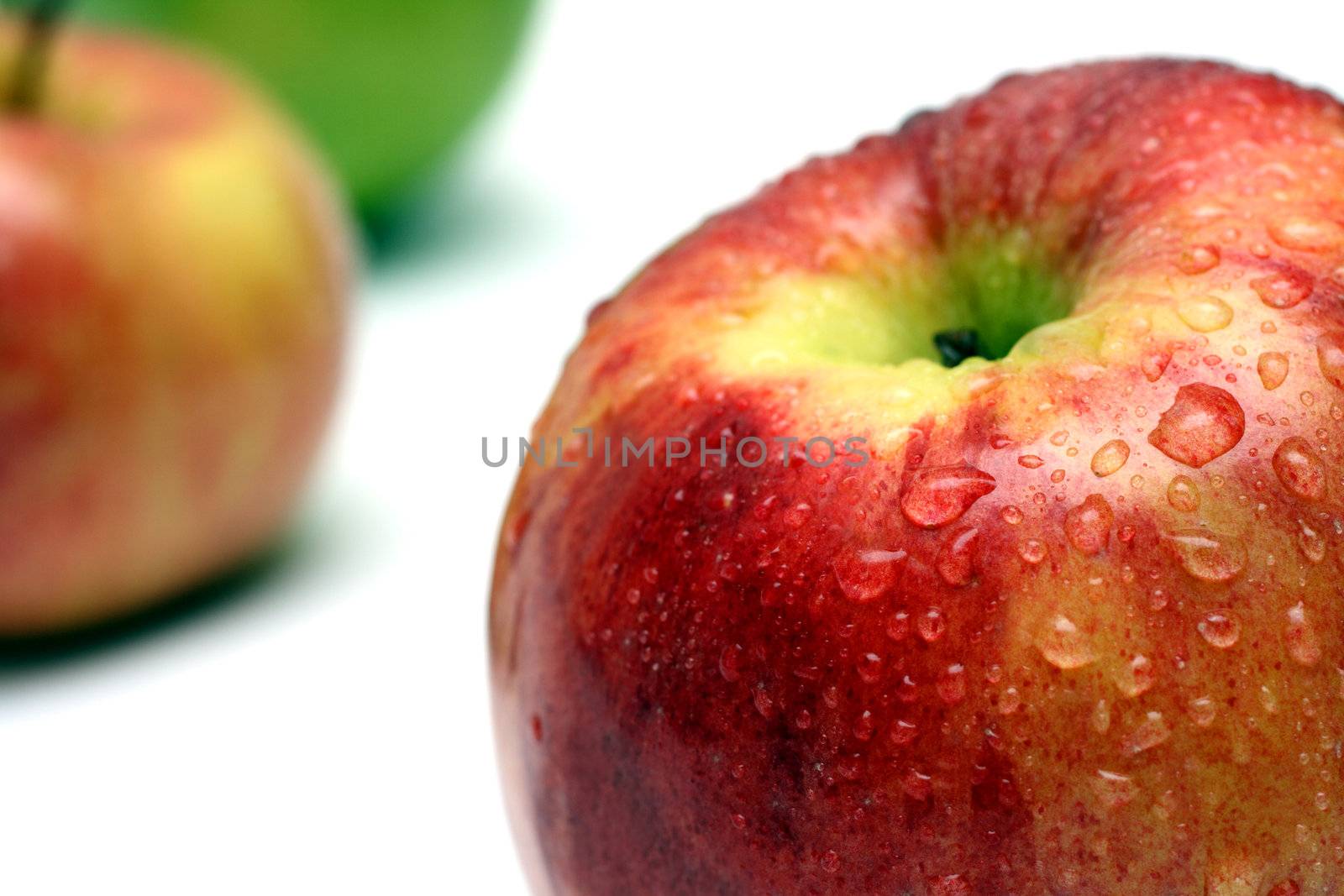 wet apple with water drops close-up